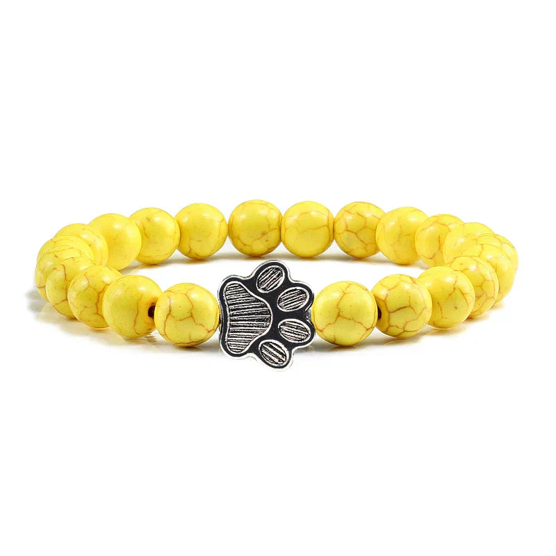 Armband met pootafdrukken versierd met kralen