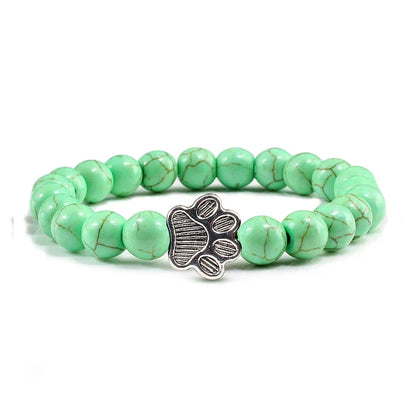 Armband met pootafdrukken versierd met kralen