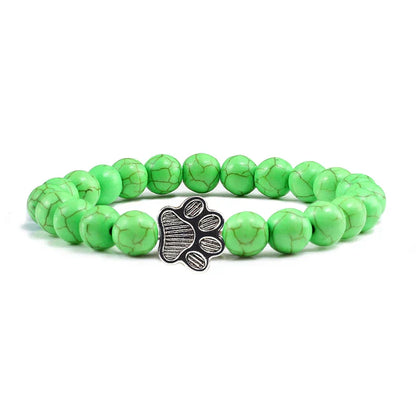 Armband met pootafdrukken versierd met kralen