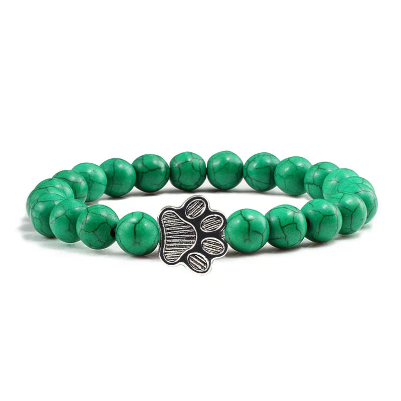 Armband met pootafdrukken versierd met kralen