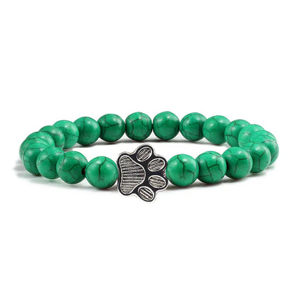 Armband met pootafdrukken versierd met kralen