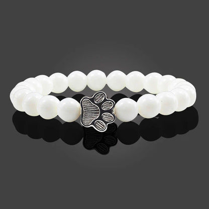 Armband met pootafdrukken versierd met kralen