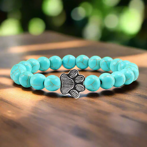 Armband met pootafdrukken versierd met kralen