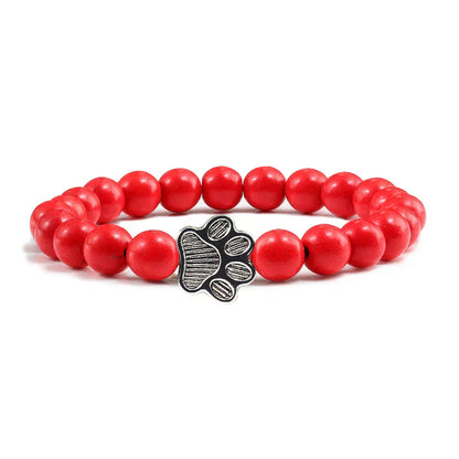Armband met pootafdrukken versierd met kralen