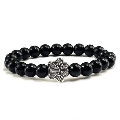 Armband met pootafdrukken versierd met kralen