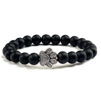 Armband met pootafdrukken versierd met kralen