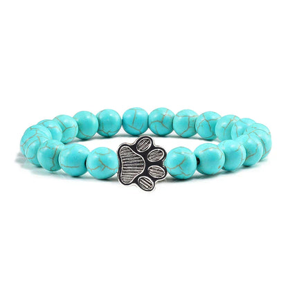 Armband met pootafdrukken versierd met kralen
